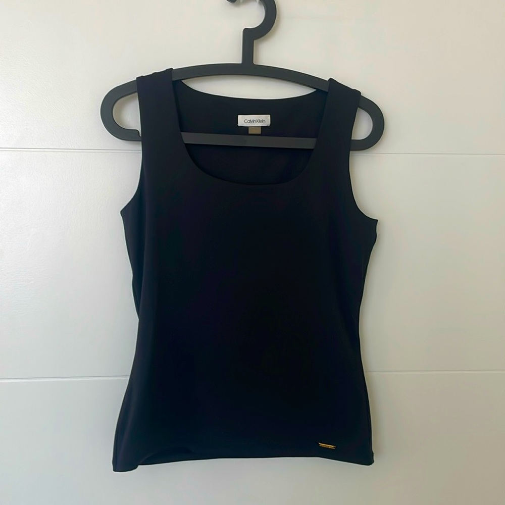 Calvin Klein top. Used twice. Excellent condition. Size small, runs a bit large